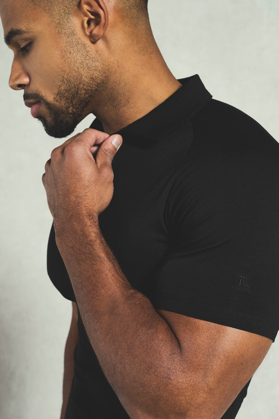 Essential Jersey Buttonless Polo Shirt in Black - TAILORED ATHLETE - USA